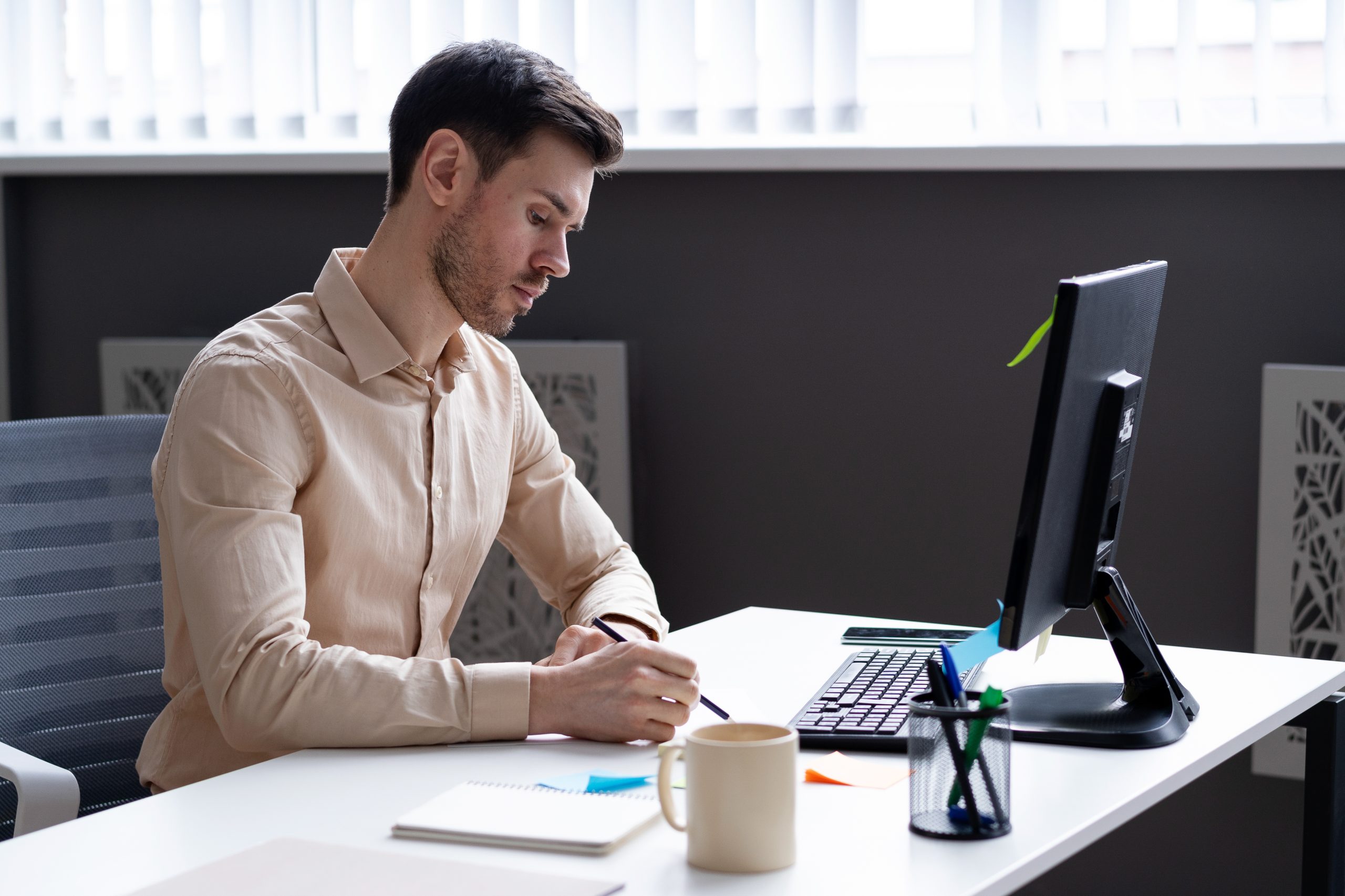 a man working with a computer- Image by Freepik